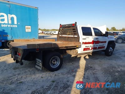 Trzecie zdjęcie samochodu z tyłu: 2017 GMC SIERRA FLATBED TRUCK VIN:1GD41VCG1HF219414 - miniatura