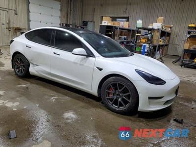 Czwarte zdjęcie samochodu z boku: 2022 TESLA MODEL 3 VIN:5YJ3E1EB9NF121018 - miniatura