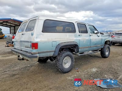 Trzecie zdjęcie samochodu z tyłu: 1990 CHEVROLET SUBURBAN V2500 VIN:1GNGV26K7LF119614 - miniatura