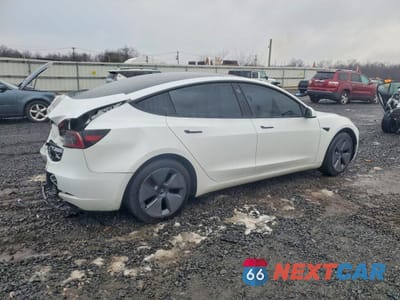 Trzecie zdjęcie samochodu z tyłu: 2023 TESLA MODEL 3 VIN:5YJ3E1EA8PF506810 - miniatura