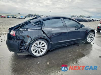 Trzecie zdjęcie samochodu z tyłu: 2022 TESLA MODEL 3 VIN:5YJ3E1EB2NF169993 - miniatura