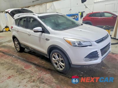 Czwarte zdjęcie samochodu z boku: 2016 FORD ESCAPE TITANIUM VIN:1FMCU9JX8GUA58471 - miniatura