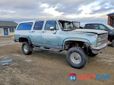 Czwarte zdjęcie samochodu z boku: 1990 CHEVROLET SUBURBAN V2500 VIN:1GNGV26K7LF119614 - miniatura