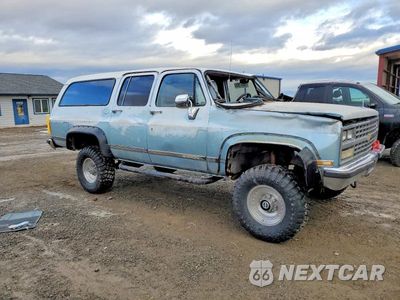 Czwarte zdjęcie samochodu z boku: 1990 CHEVROLET SUBURBAN V2500 VIN:1GNGV26K7LF119614 - miniatura