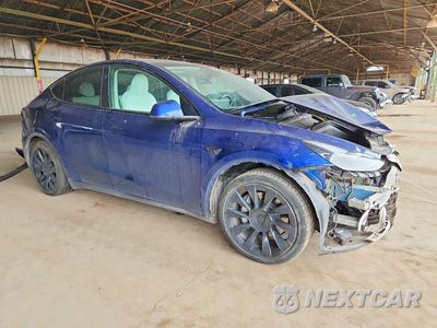 Czwarte zdjęcie samochodu z boku: 2023 TESLA MODEL Y VIN:7SAYGAEE8PF797816 - miniatura