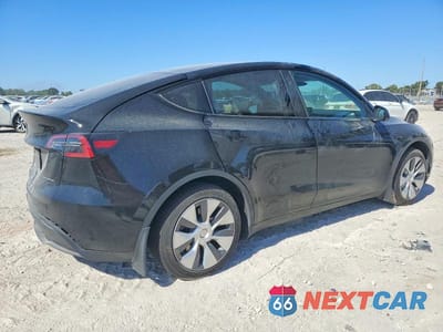 Trzecie zdjęcie samochodu z tyłu: 2023 TESLA MODEL Y VIN:7SAYGDEE8PA136981 - miniatura