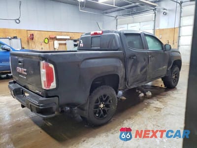 Trzecie zdjęcie samochodu z tyłu: 2022 GMC CANYON AT4 VIN:1GTG6FEN5N1146190 - miniatura