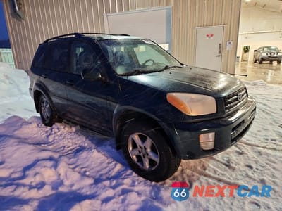 Czwarte zdjęcie samochodu z boku: 2002 TOYOTA RAV4 BASE VIN:JTEHH20V020143774 - miniatura