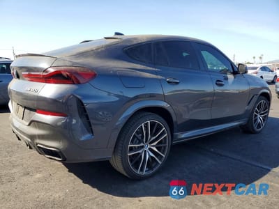 Trzecie zdjęcie samochodu z tyłu: 2021 BMW X6 M50I VIN:5UXCY8C09M9E39040 - miniatura