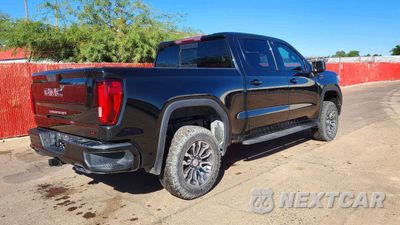 Czwarte zdjęcie samochodu z boku: 2021 GMC SIERRA K1500 AT4 VIN:1GTP9EEL6MZ286233 - miniatura