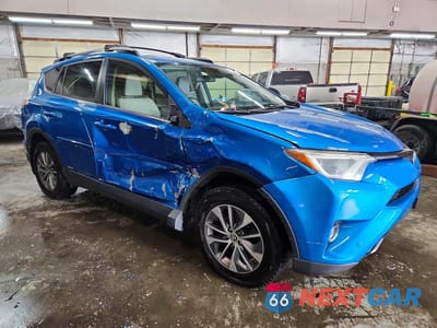 Czwarte zdjęcie samochodu z boku: 2018 TOYOTA RAV4 HYBRID XLE VIN:JTMRJREV6JD231721 - miniatura
