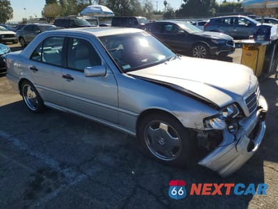 Czwarte zdjęcie samochodu z boku: 1998 MERCEDES-BENZ C 43 VIN:WDBHA33GXWF705001 - miniatura