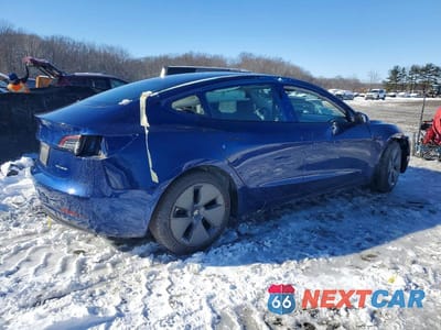 Trzecie zdjęcie samochodu z tyłu: 2022 TESLA MODEL 3 VIN:5YJ3E1EB7NF103407 - miniatura