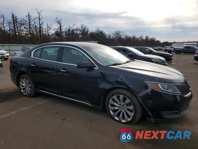 Czwarte zdjęcie samochodu z boku: 2014 LINCOLN MKS VIN:1LNHL9EK9EG600731 - miniatura