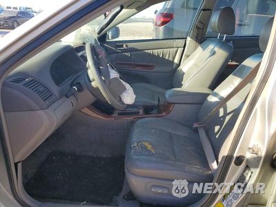 Zdjęcie 7 z 11 samochodu: 2004 TOYOTA CAMRY LE VIN:4T1BE30K34U902603 - miniatura