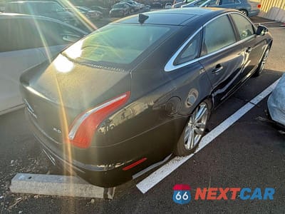 Czwarte zdjęcie samochodu z boku: 2013 JAGUAR XJL PORTFOLIO VIN:SAJWA2GB2DLV42961 - miniatura