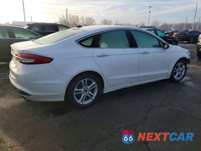 Trzecie zdjęcie samochodu z tyłu: 2018 FORD FUSION SE VIN:3FA6P0HD9JR176078 - miniatura