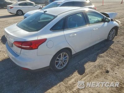 Trzecie zdjęcie samochodu z tyłu: 2017 FORD FOCUS SE VIN:1FADP3F20HL285659 - miniatura