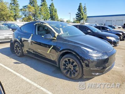 Czwarte zdjęcie samochodu z boku: 2023 TESLA MODEL Y VIN:7SAYGAEE0PF958255 - miniatura