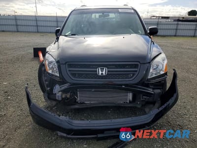 Piąte zdjęcie samochodu w środku: 2005 HONDA PILOT EXL VIN:2HKYF18555H572733 - miniatura