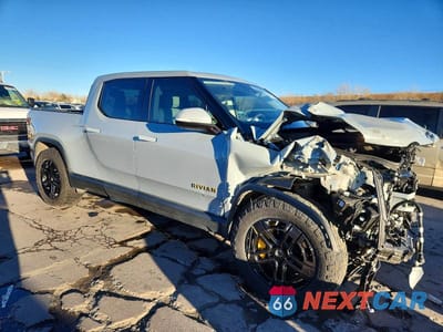 Czwarte zdjęcie samochodu z boku: 2022 RIVIAN R1T ADVENTURE VIN:7FCTGAAA7NN013001 - miniatura