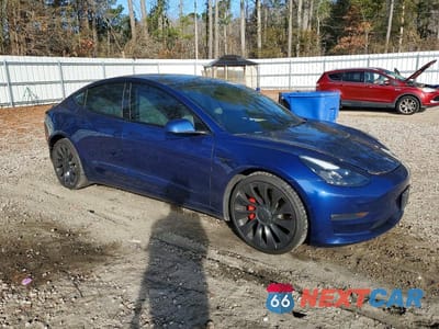 Czwarte zdjęcie samochodu z boku: 2022 TESLA MODEL 3 VIN:5YJ3E1EC9NF104535 - miniatura