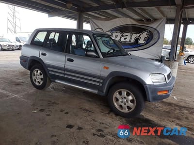 Czwarte zdjęcie samochodu z boku: 1997 TOYOTA RAV4 BASE VIN:JT3HP10VXV7033073 - miniatura