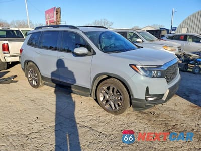 Czwarte zdjęcie samochodu z boku: 2022 HONDA PASSPORT EXL VIN:5FNYF7H55NB003785 - miniatura