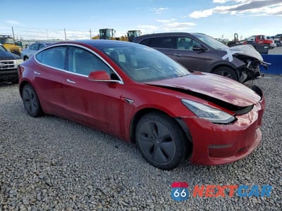 Czwarte zdjęcie samochodu z boku: 2018 TESLA MODEL 3 VIN:5YJ3E1EB4JF133670 - miniatura