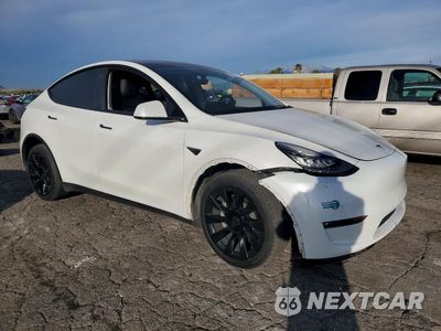 Czwarte zdjęcie samochodu z boku: 2022 TESLA MODEL Y VIN:7SAYGDEE6NF396165 - miniatura