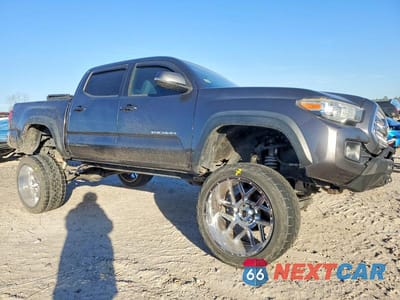 Czwarte zdjęcie samochodu z boku: 2016 TOYOTA TACOMA DOUBLE CAB VIN:5TFCZ5AN4GX027990 - miniatura