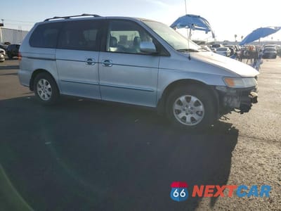 Czwarte zdjęcie samochodu z boku: 2002 HONDA ODYSSEY EXL VIN:2HKRL18042H584689 - miniatura