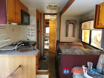 Zdjęcie 10 z 12 samochodu: 2005 FORD E450 RECREATIONAL VEHICLE VIN:1FDXE45S95HA14422 - miniatura