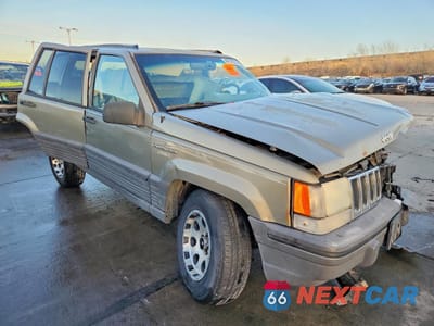 Czwarte zdjęcie samochodu z boku: 1995 JEEP GRAND CHEROKEE LAREDO VIN:1J4GZ58S2SC571119 - miniatura