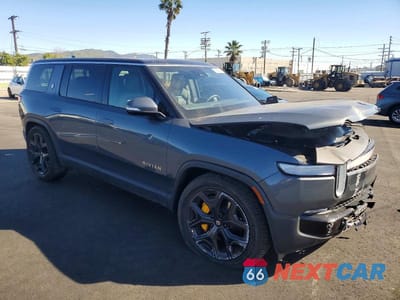 Czwarte zdjęcie samochodu z boku: 2023 RIVIAN R1S ADVENTURE VIN:7PDSGABA1PN021820 - miniatura