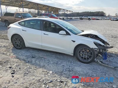 Czwarte zdjęcie samochodu z boku: 2023 TESLA MODEL 3 VIN:5YJ3E1EB0PF388096 - miniatura