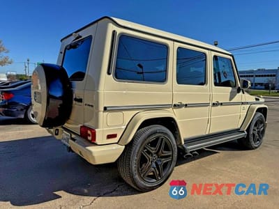 Czwarte zdjęcie samochodu z boku: 2015 MERCEDES-BENZ G 63 AMG VIN:WDCYC7DF9FX234021 - miniatura