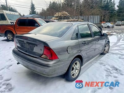 Czwarte zdjęcie samochodu z boku: 2002 FORD FOCUS SE VIN:1FAFP34312W291481 - miniatura