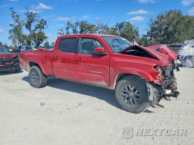 Czwarte zdjęcie samochodu z boku: 2022 TOYOTA TACOMA VIN:3TMDZ5BN6NM128261 - miniatura