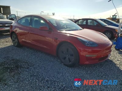 Czwarte zdjęcie samochodu z boku: 2022 TESLA MODEL 3 VIN:5YJ3E1EA3NF235829 - miniatura
