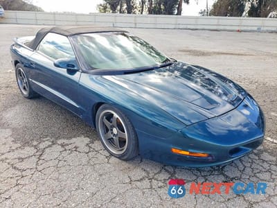 Czwarte zdjęcie samochodu z boku: 1997 PONTIAC GRAND AM VIN:2G2FV32P4V2205385 - miniatura