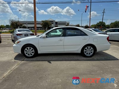 Zdjęcie 12 z 13 samochodu: 2002 TOYOTA CAMRY LE VIN:4T1BE32K52U027812 - miniatura