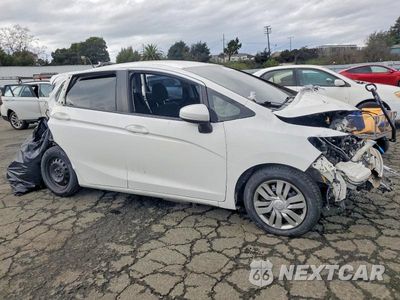 Czwarte zdjęcie samochodu z boku: 2016 HONDA FIT LX VIN:3HGGK5H57GM701603 - miniatura