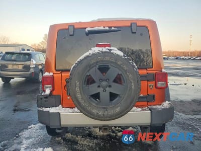 Zdjęcie 6 z 12 samochodu: 2011 JEEP WRANGLER UNLIMITED SAHARA VIN:1J4HA5H1XBL572649 - miniatura