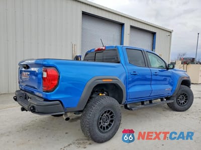 Trzecie zdjęcie samochodu z tyłu: 2024 GMC CANYON AT4X VIN:1GTP6EEK5R1230788 - miniatura