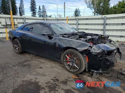 Czwarte zdjęcie samochodu z boku: 2024 DODGE CHARGER DAYTONA SCAT PACK VIN:2C3CDBDK3RR204968 - miniatura