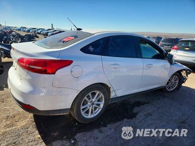 Trzecie zdjęcie samochodu z tyłu: 2017 FORD FOCUS VIN:1FADP3F20HL320152 - miniatura