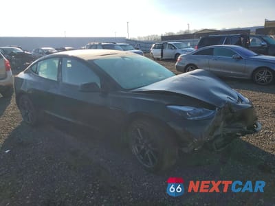 Czwarte zdjęcie samochodu z boku: 2022 TESLA MODEL 3 VIN:5YJ3E1EA1NF102776 - miniatura