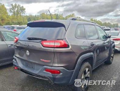Czwarte zdjęcie samochodu z boku: 2014 JEEP CHEROKEE TRAILHAWK VIN:1C4PJMBS4EW160565 - miniatura