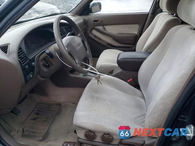 Zdjęcie 7 z 12 samochodu: 1995 TOYOTA CAMRY LE VIN:JT2GK12E1S0124877 - miniatura